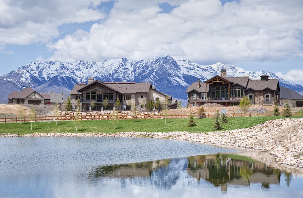 Exterior view of The Cottonwoods residential development, homes and lake