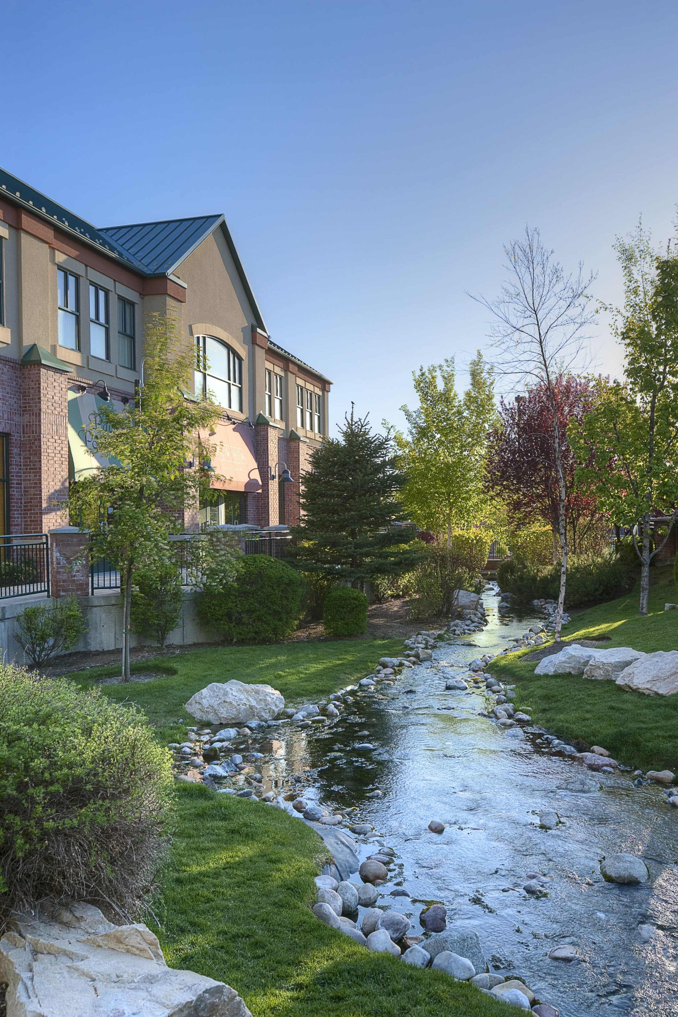 Exterior view of Sugarhouse Commons and riverbank