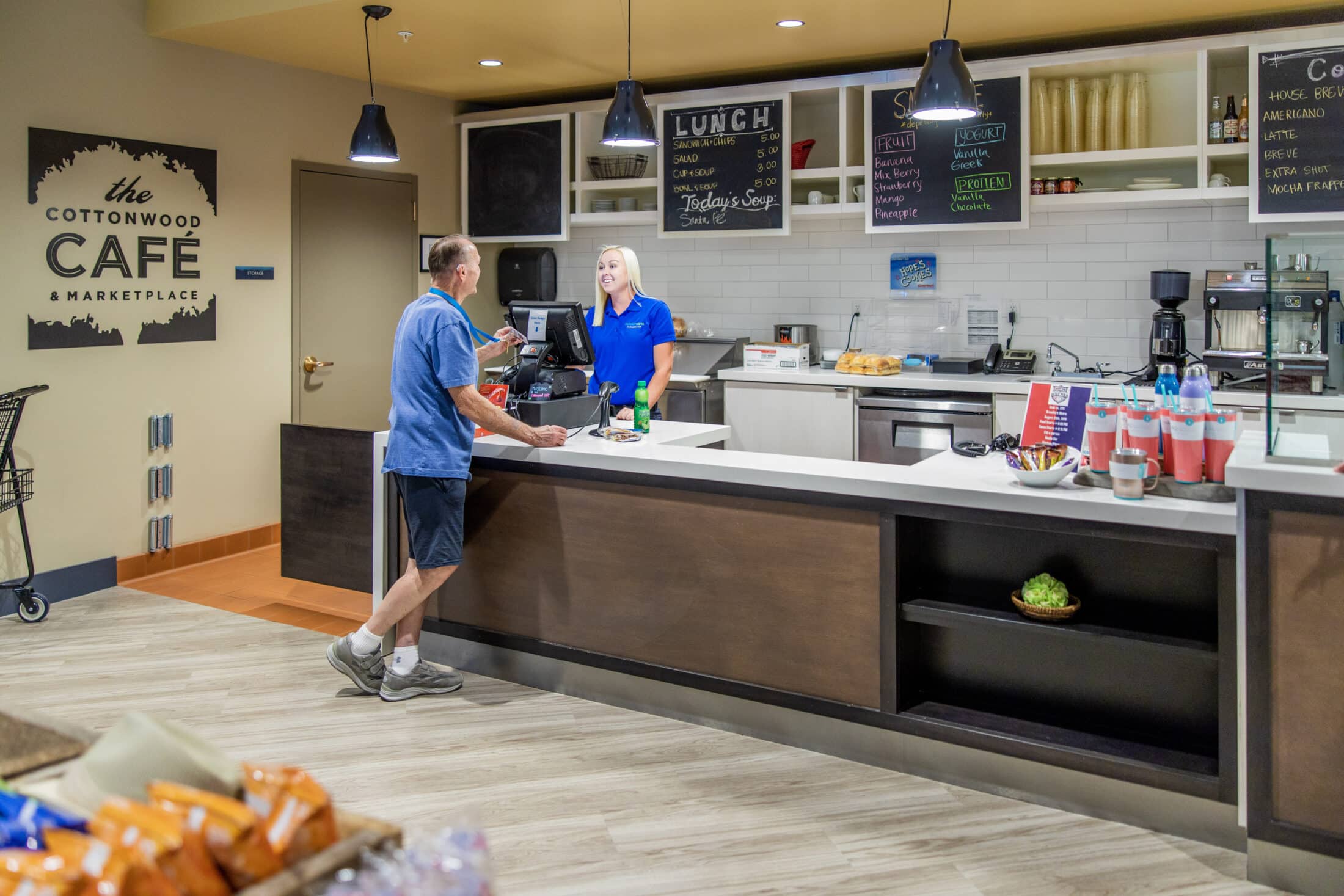 Interior of Summit Vista, man ordering food at the Cottonwood Cafe